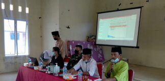 Babinsa Serda Olih Solihin Hadiri Rapat Rembuk Stanting di Desa Ulu Maras