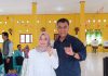 Bupati Natuna dan Istri Gunakan Hak Pilih di TPS 009