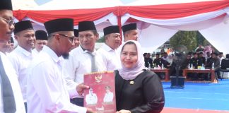 Bupati Kasmarni Kukuhkan Perpanjangan Kades dan BPD Kecamatan Pinggir dan Talang Muandau Secara Serentak