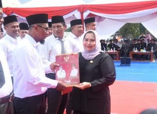 Bupati Kasmarni Kukuhkan Perpanjangan Kades dan BPD Kecamatan Pinggir dan Talang Muandau Secara Serentak
