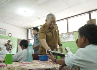Sekdakab Asahan Launching Gerakan Serentak Uji Coba Makanan Gratis Bagi Peserta Didik di Kabupaten Asahan