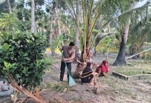 Bhabinkamtibmas Polsek Senayang Bersama Warga Gotong Royong Bersihkan TPU di Desa Penaah