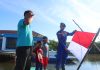 Satpolairud dan Polsek Jajaran Polres Natuna Bagikan Bendera Merah Putih, Kobarkan Semangat HUT ke-81 Kemerdekaan RI