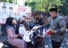Bupati Asahan Pimpin Gerakan Pembagian Bendera Merah Putih Sambut HUT Ke-81 Kemerdekaan RI